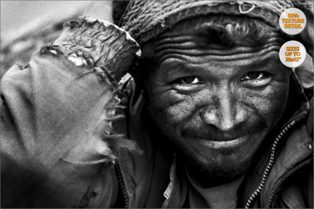 Porter carrying stones, Himalaya.