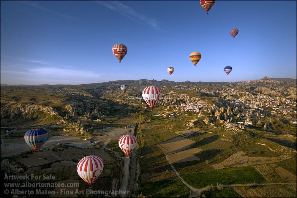 Balloons over rock formations, Cappadocia, Turkey, by Alberto Mateo.