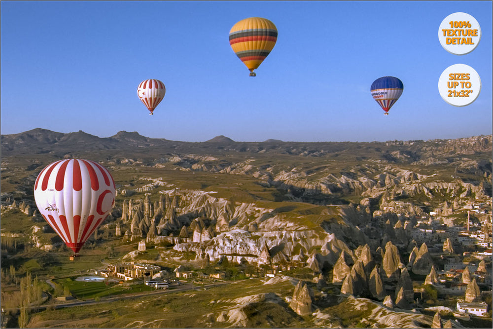 Balloons over rock formations, Cappadocia, Turkey.