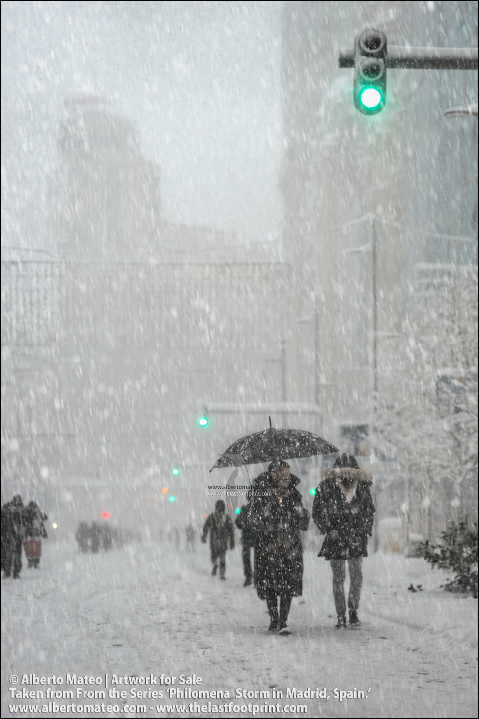 Pedestrians under Edificio Capitol, Gran Via, Filomena Winter Snow Storm, Madrid, Spain.
