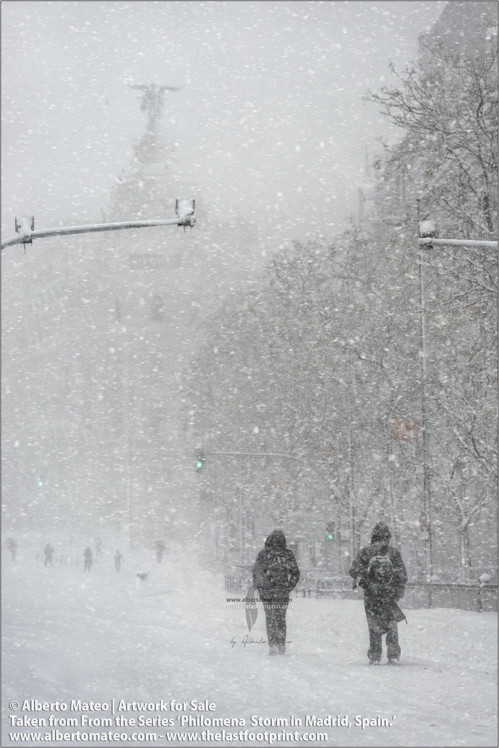Pedestrians under Edificio Metropolis, Gran Via, Filomena Winter Snow Storm, Madrid, Spain.