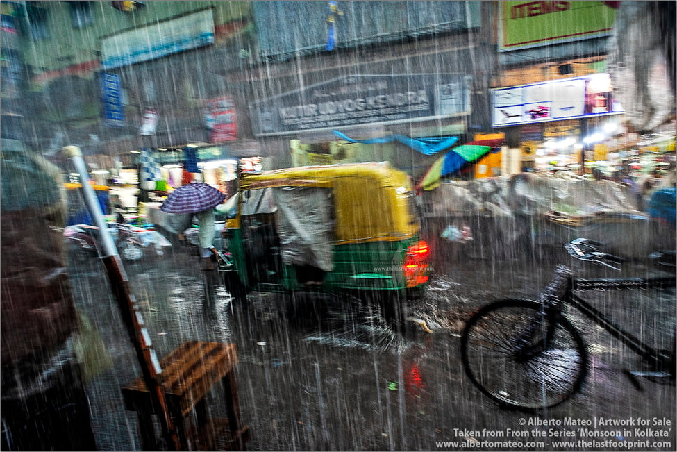 Traffic under Heavy Downpour, Bara Bazar, Kolkata, Bengal, India.