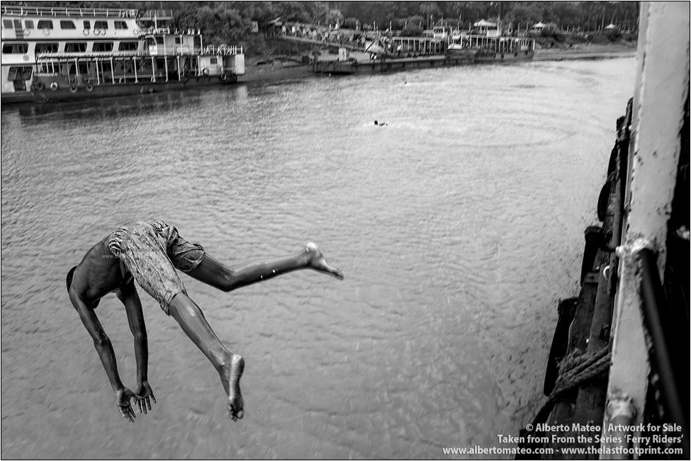 Young Boy diving on Hooghly River, Kolkata, India.