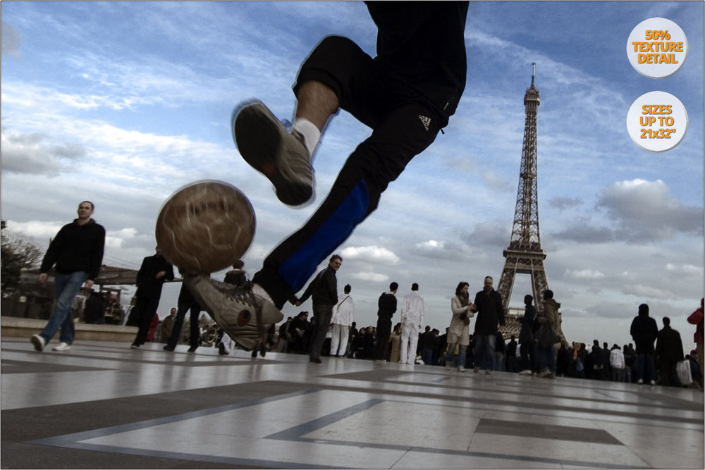 Boys playing soccer near Eiffel Tower, Paris, France. | 50% Detail.