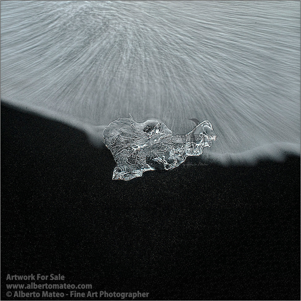Ice block and surf, Diamond Beach, Jokulsarlon, Iceland.