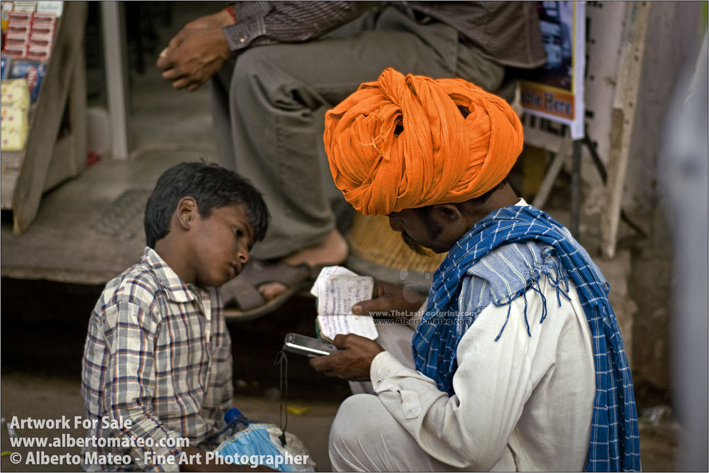 Man and son with agenda, Pushkar Camel Fair. | Open Edition Fine Art Print.