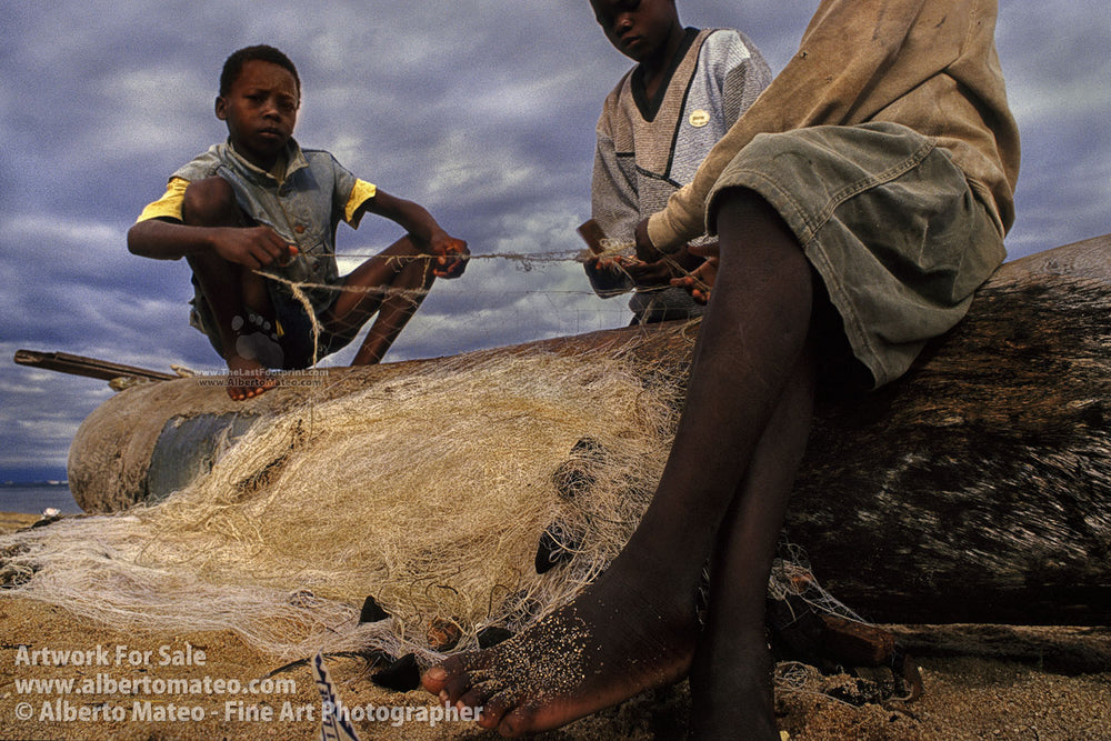 Children repairing nets, Cape Mclear, Malawi. | By Alberto Mateo, Fine Art Photographer.