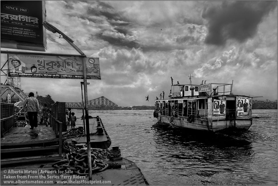 Boy diving from the roof of ship, Kolkata, India.