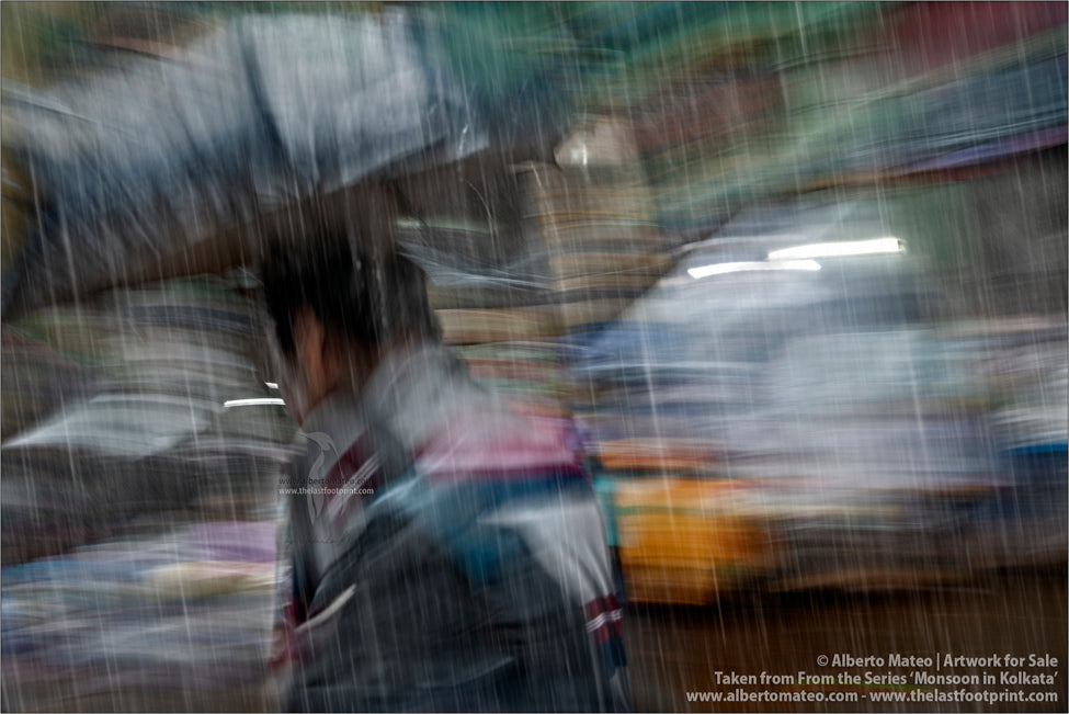 Pedestrian under umbrella, Kolkata, Bengal, India.