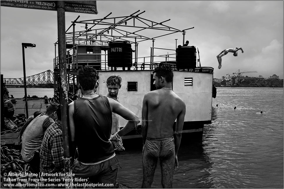 Boy jumping from the roof of ship, Kolkata, India.