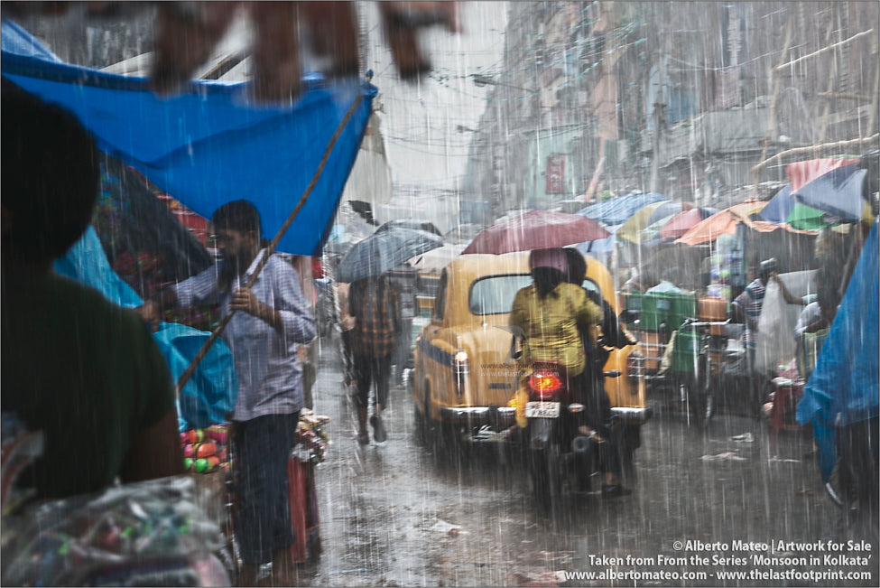 Traffic under Monsoon rain, Bara Bazar, Kolkata, Bengal, India.
