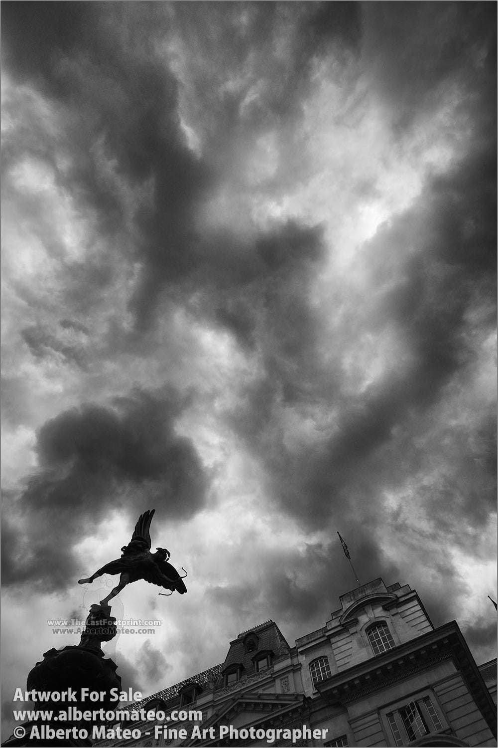 Eros sculpture and storm clouds, Picadilly, London. | Full view.