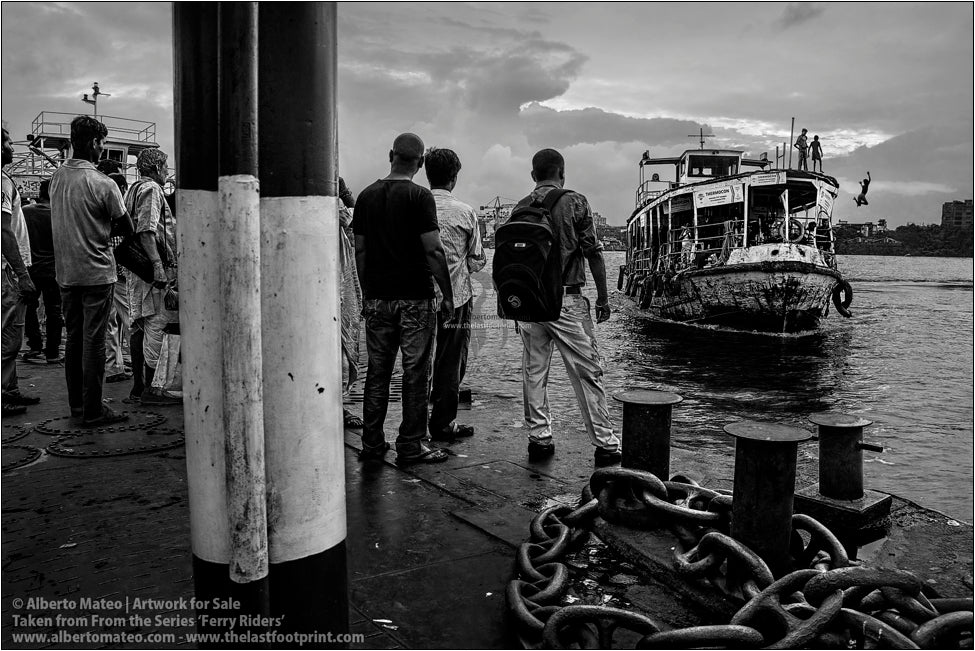 Passengers on dock in Hooghly River, Kolkata, India.