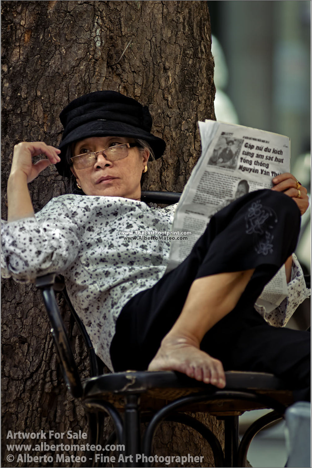 Woman reading the newspaper, Hanoi, Vietnam. | Unlimited Edition Fine Art Print.