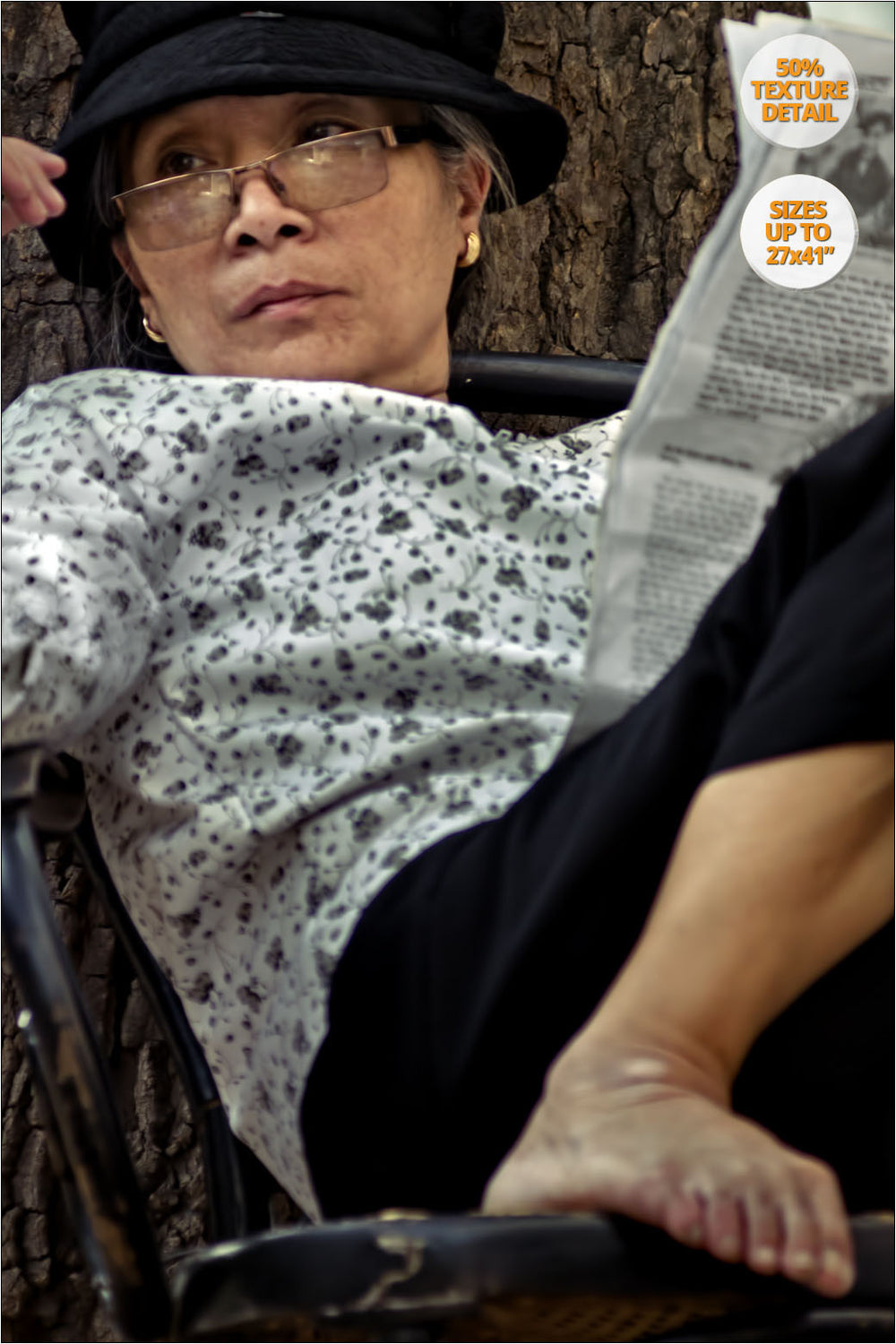 Portrait of woman reading the newspaper, Vietnam. | 50% Magnification Detail.