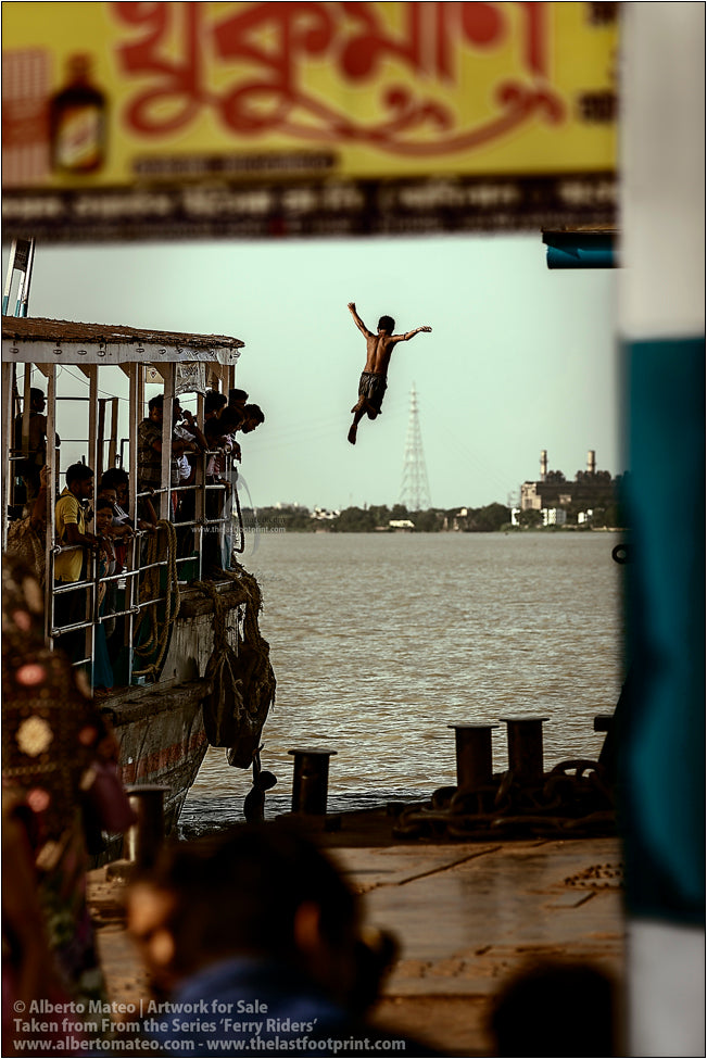 Boy diving from the roof of a ship, Kolkata, India.