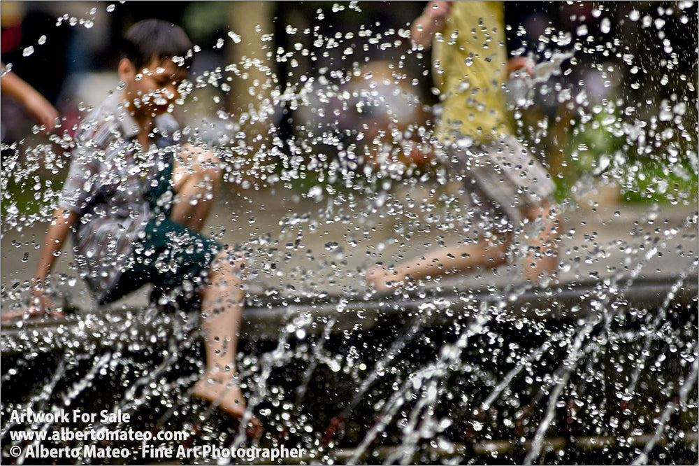 Boys playing in fountain, Hanoi, Vietnam.