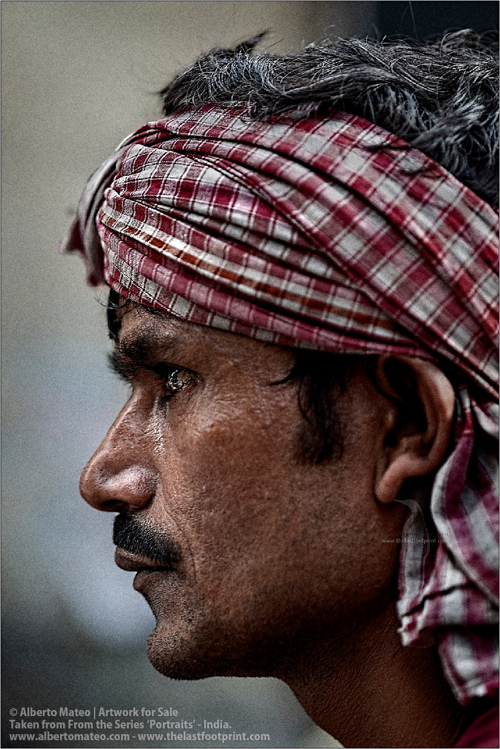 Profile portrait of Porter in Bara Bazar streets, Kolkata, India.