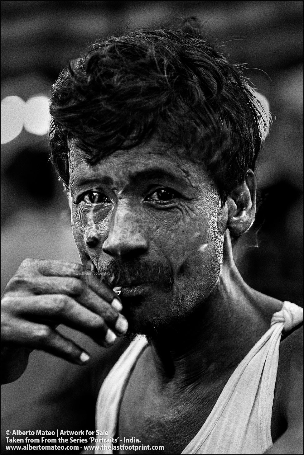 Portrait of smoking Porter, Bara Bazar, Kolkata, India.