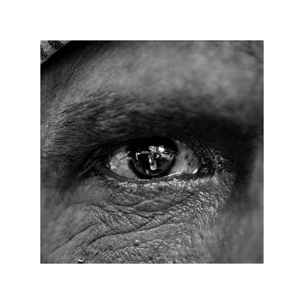 Self portrait in the iris of a Porter, Bara Bazar, Kolkata, India.
