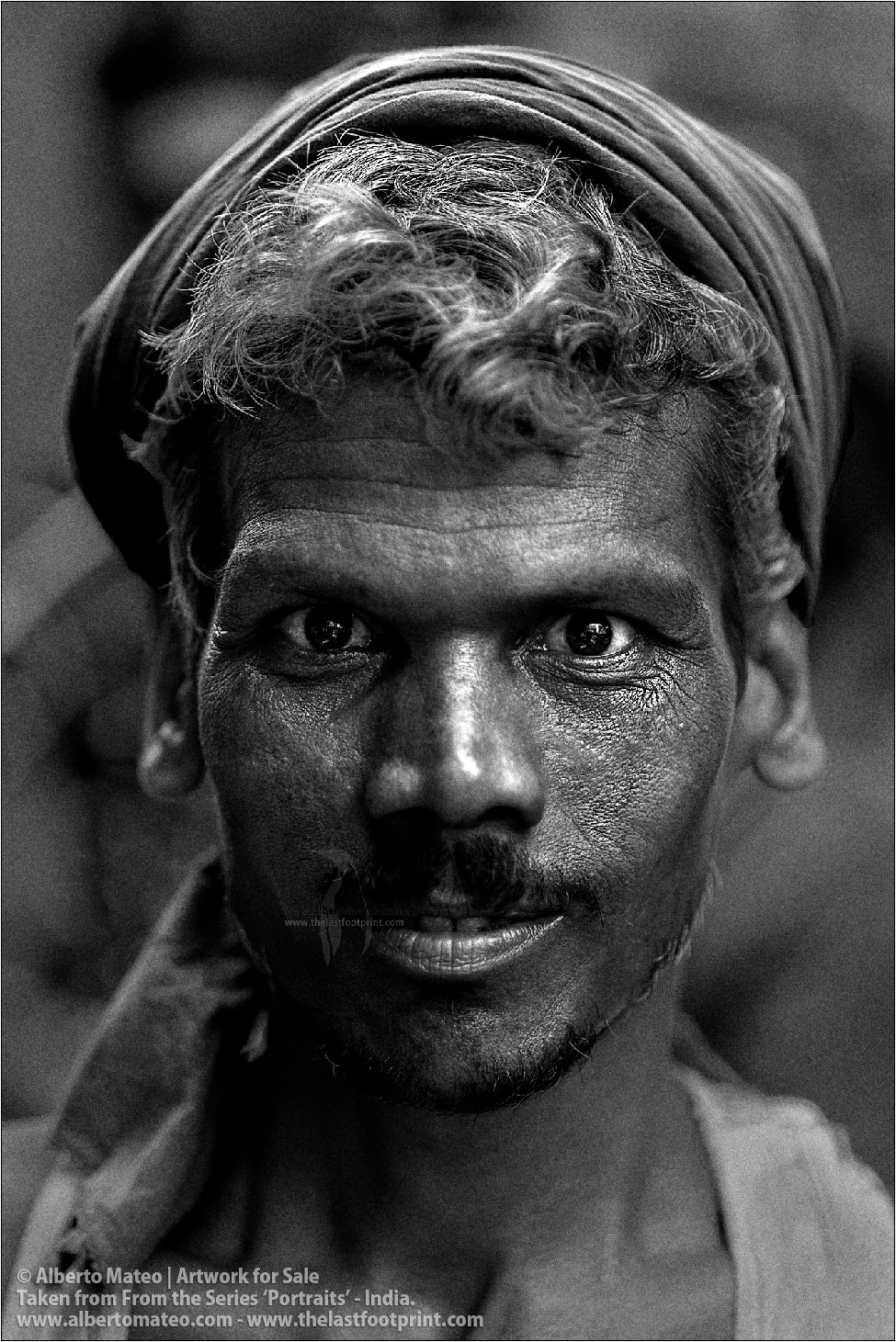 Portrait of Smiling Porter in Bara Bazar streets, Kolkata, India.