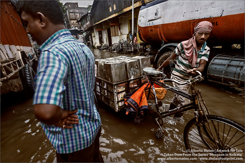Porters in flooded streets, Kolkata, Bengal, India.