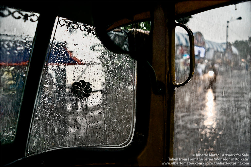 Motorbike in the rain in the ghats, Kolkata, Bengal, India.