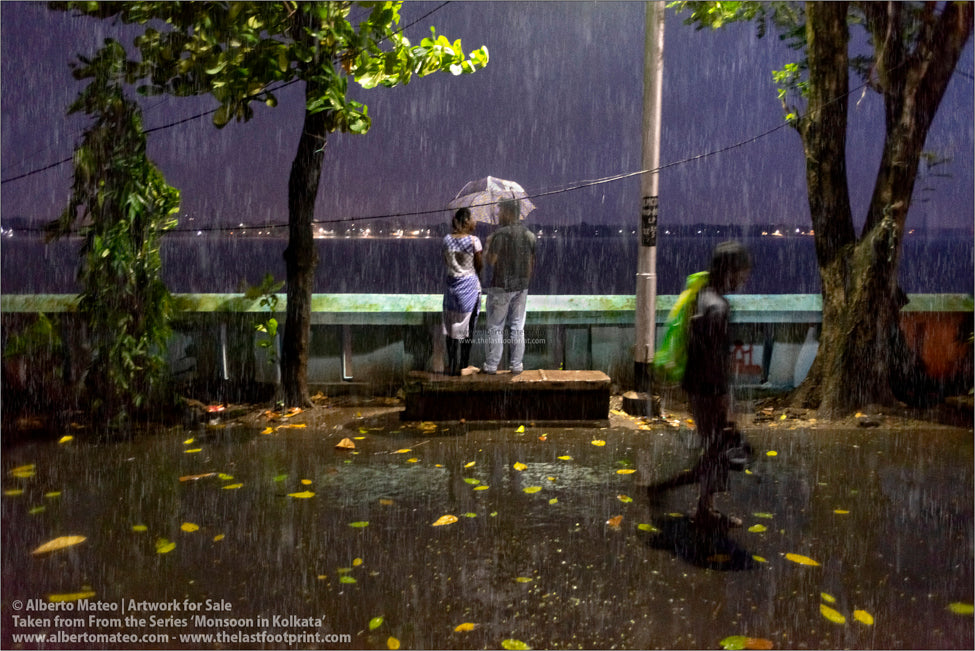 Couple under the rain, Hooghly River, Kolkata, Bengal, India.