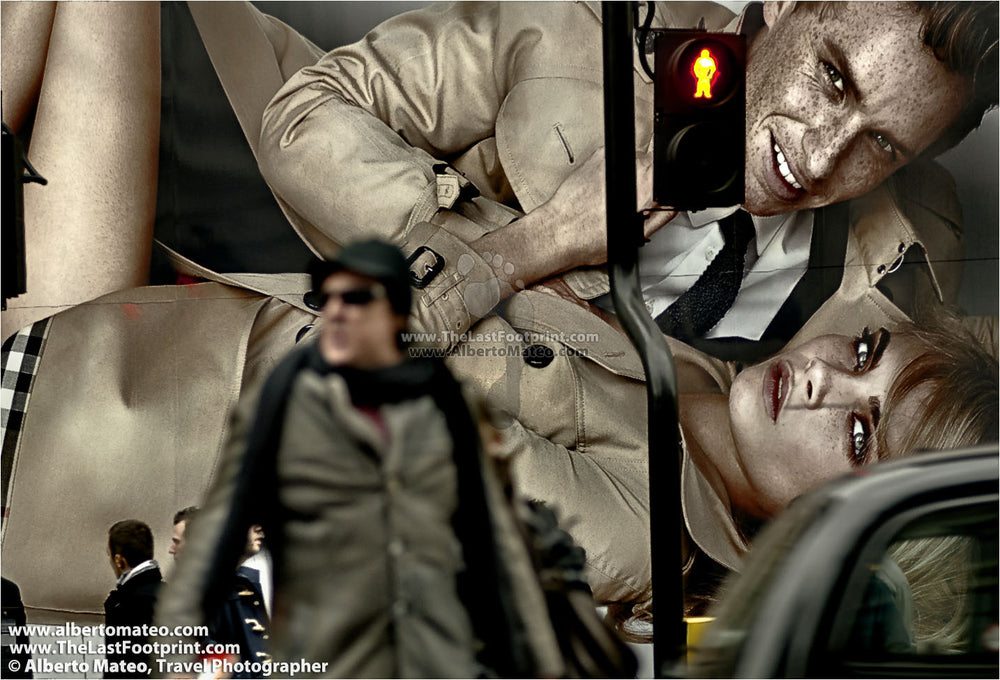 Pedestrian next to advertising in the Regent Street, London, United Kingdom.