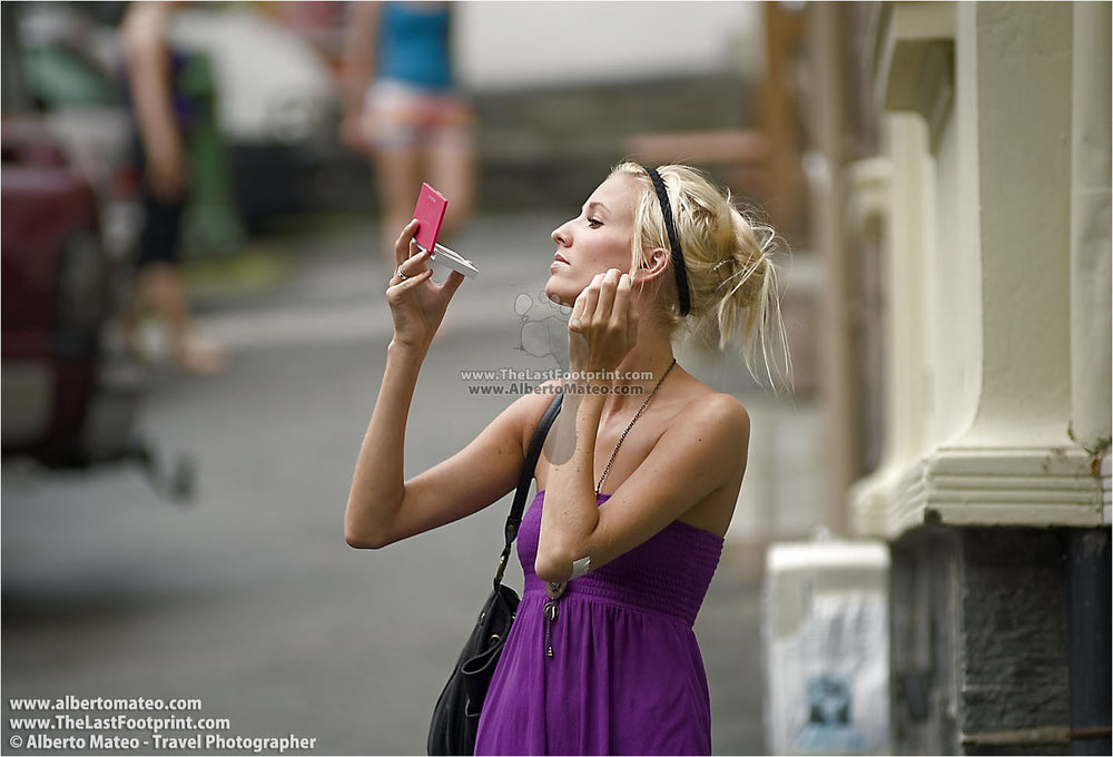 Woman making up, City of Bergen, Norway. | Not for Sale.
