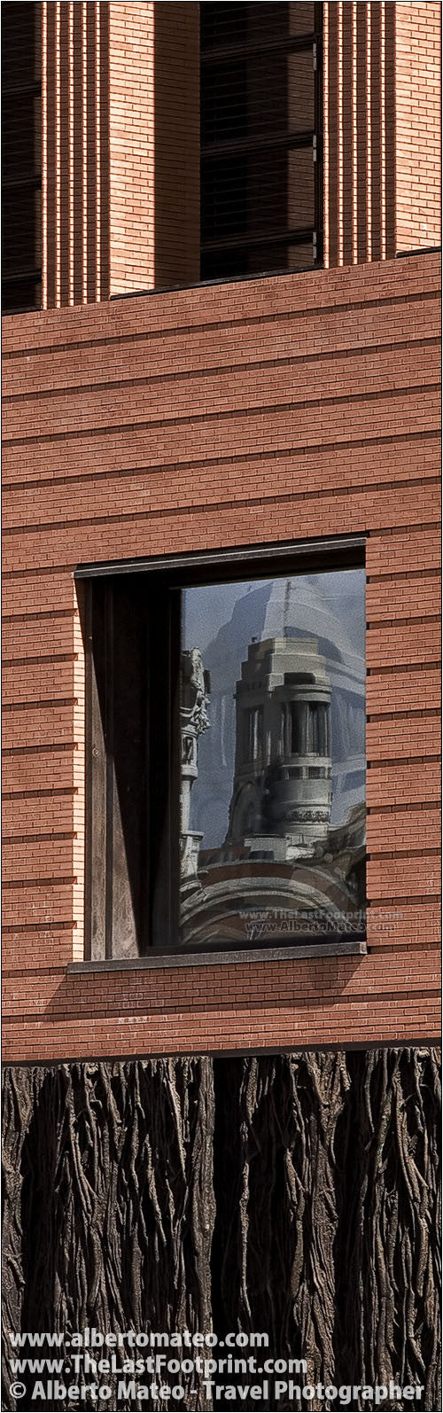 Bellas Artes Building reflected on Prado Museum, Madrid.