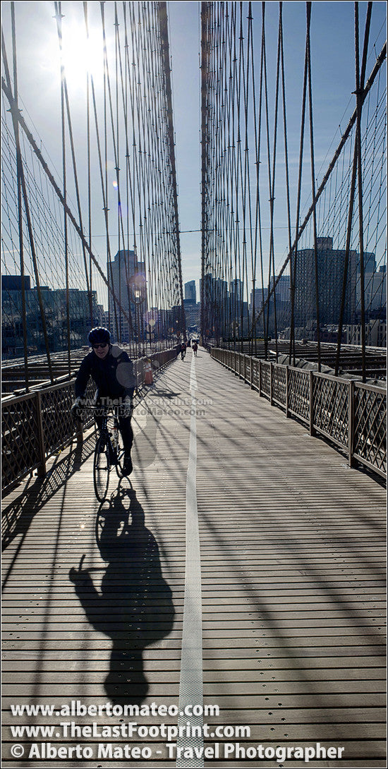 Cyclist in Brooklyn Bridge, New York City.