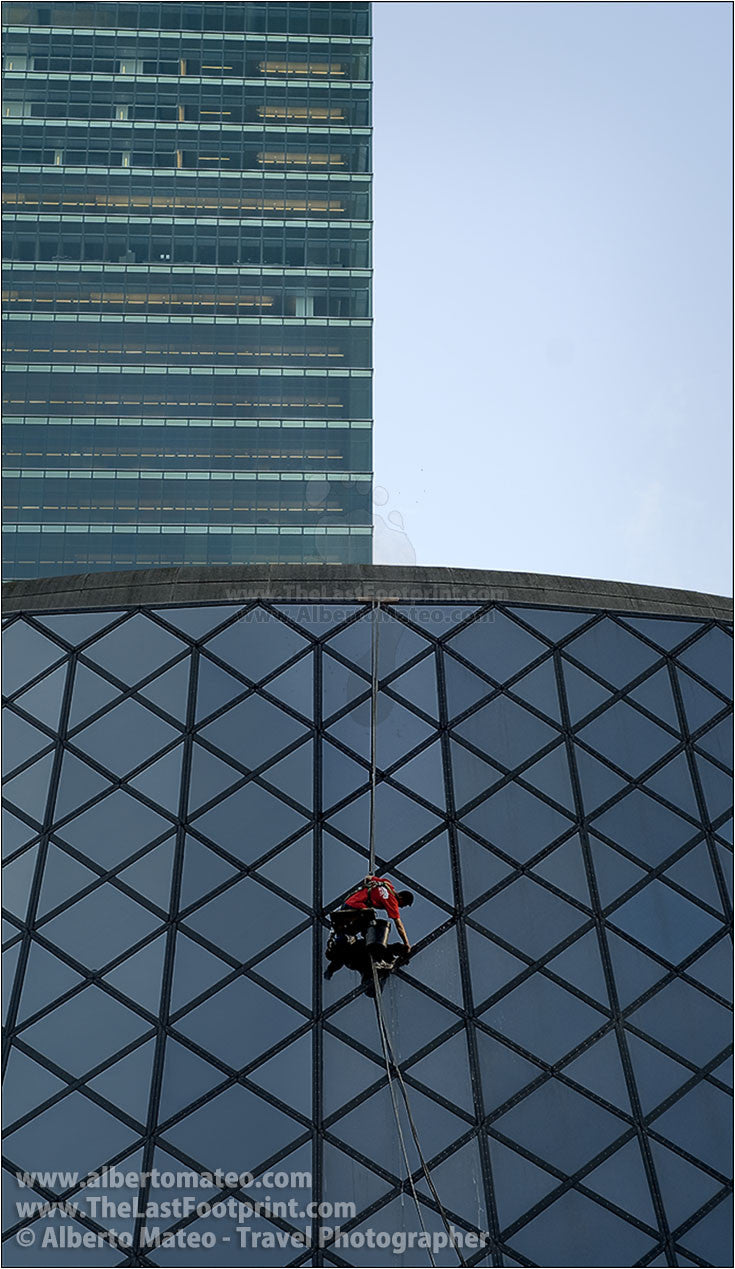 Window cleaner on the Roy Thomson Hall, Toronto. | Vertical crop.