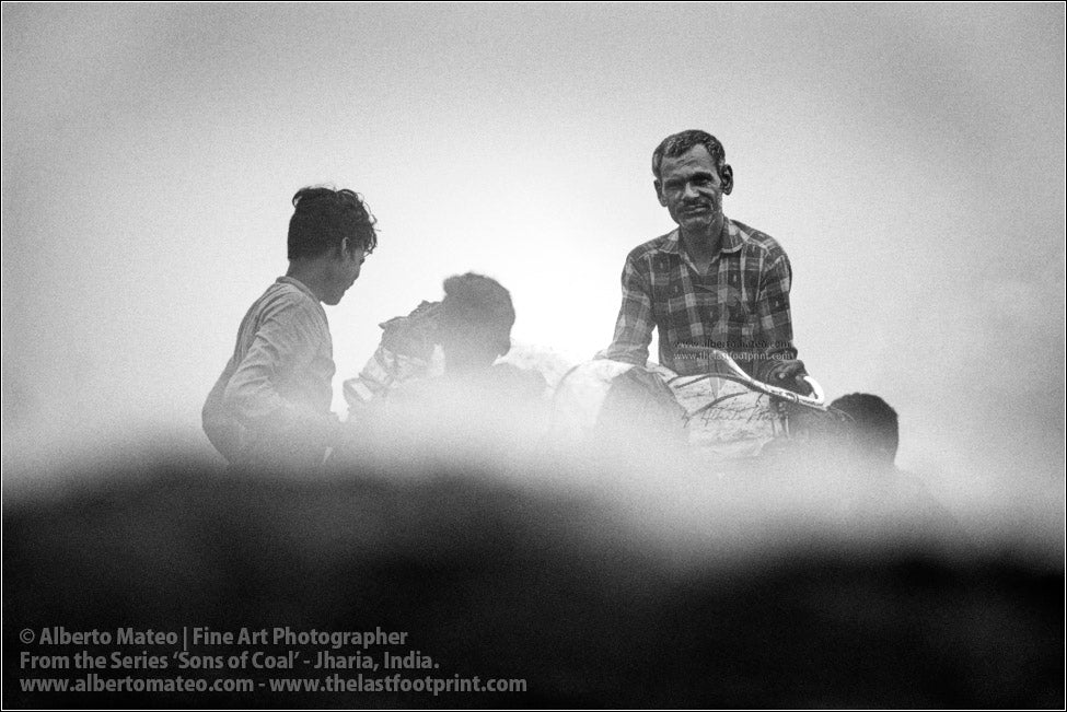Man and Sons loading a Bicycle with Coal Bags, Sons of Coal Series.