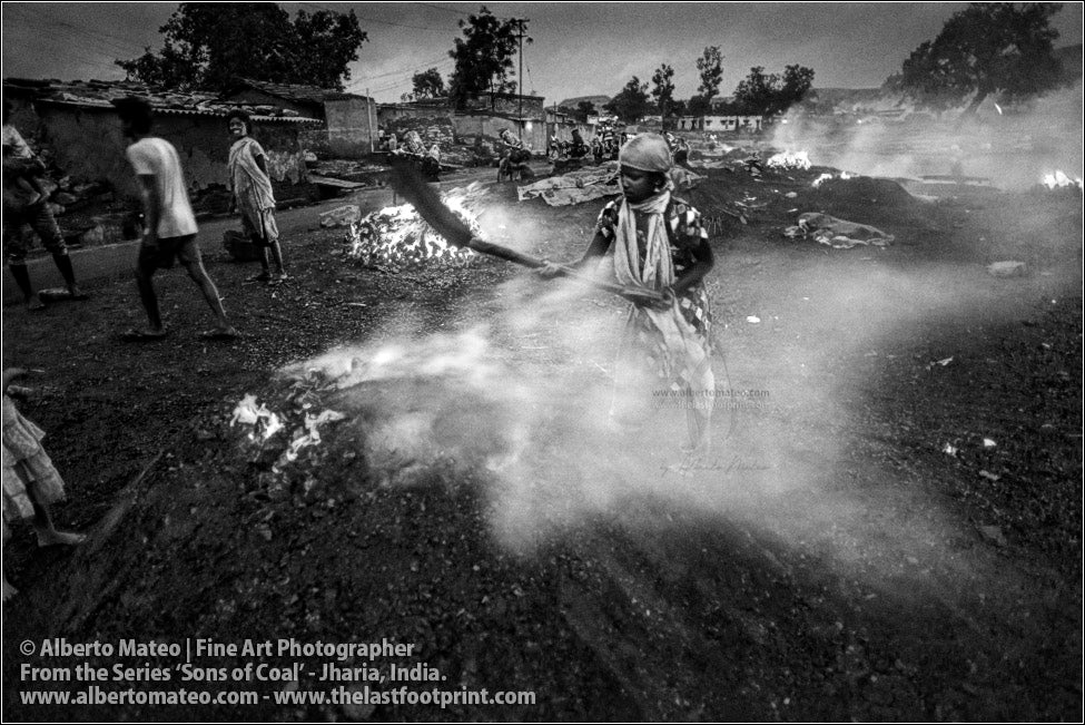 Woman covering Bonfire with Shovel, Sons of Coal Series.