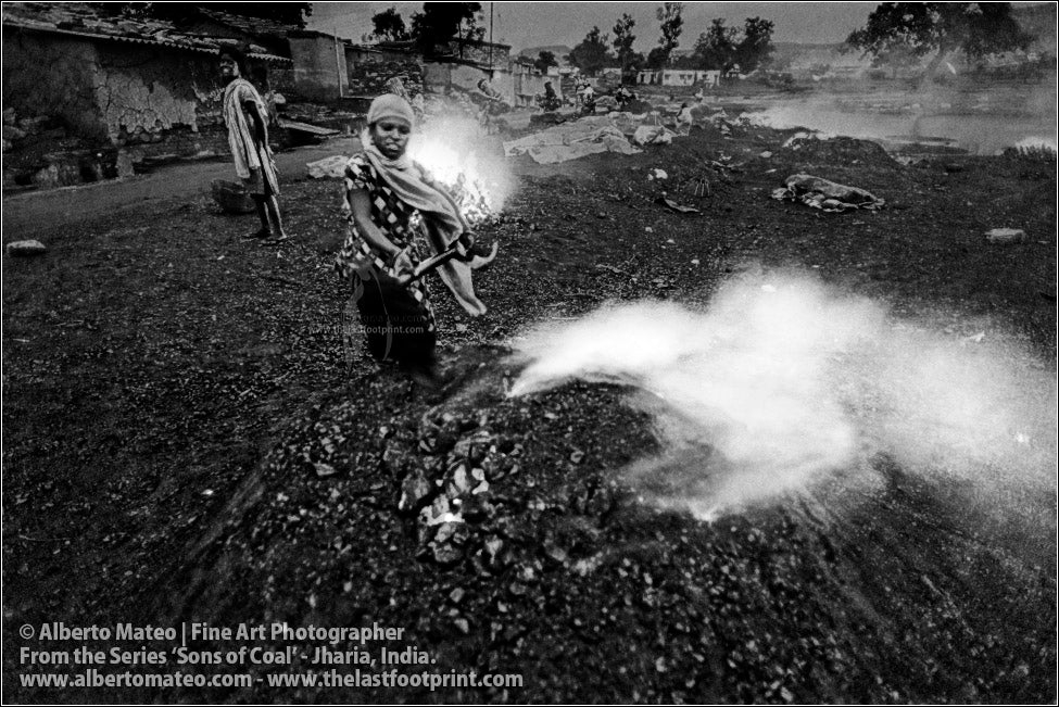 Woman covering Bonfire with Sand, Sons of Coal Series.
